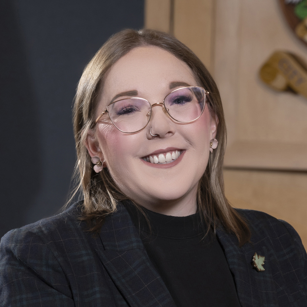 Headshot of Councillor Cori Ramsay in council chambers, with City of Prince George crest partially visible in background.